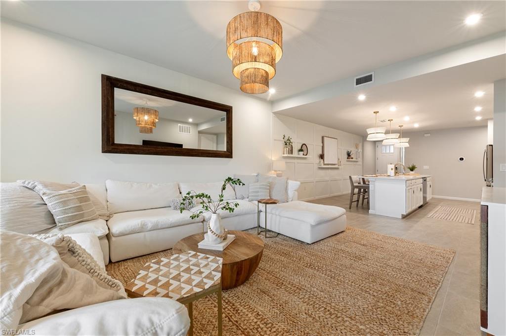 Living room featuring recessed lighting and a chandelier