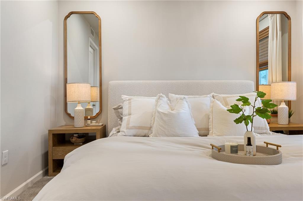 Carpeted bedroom featuring baseboards