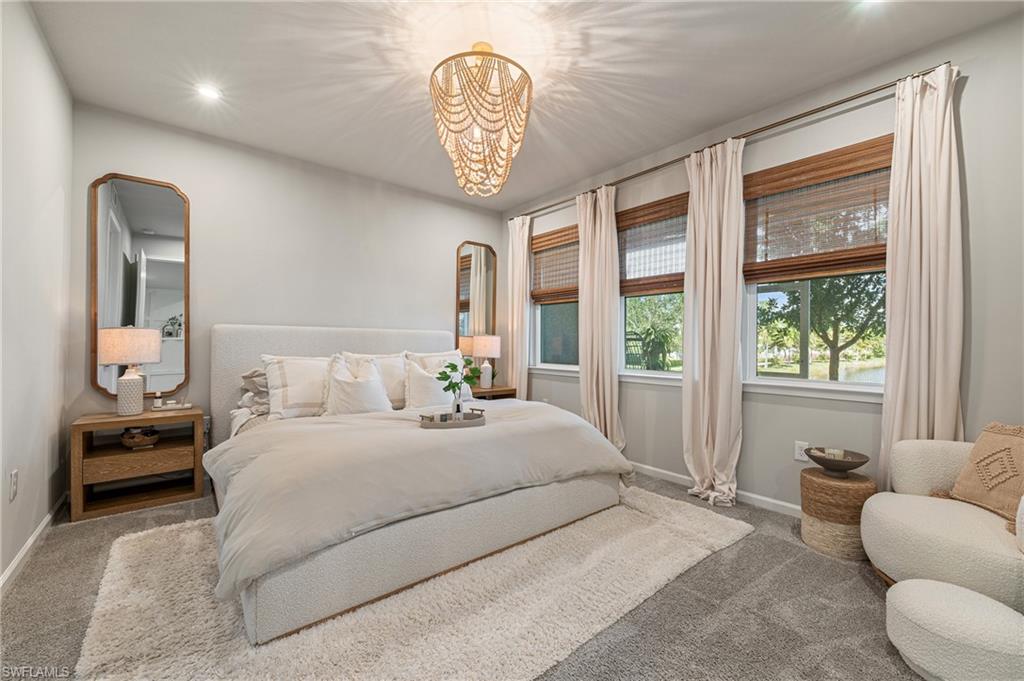 Bedroom with carpet floors, recessed lighting, and a chandelier