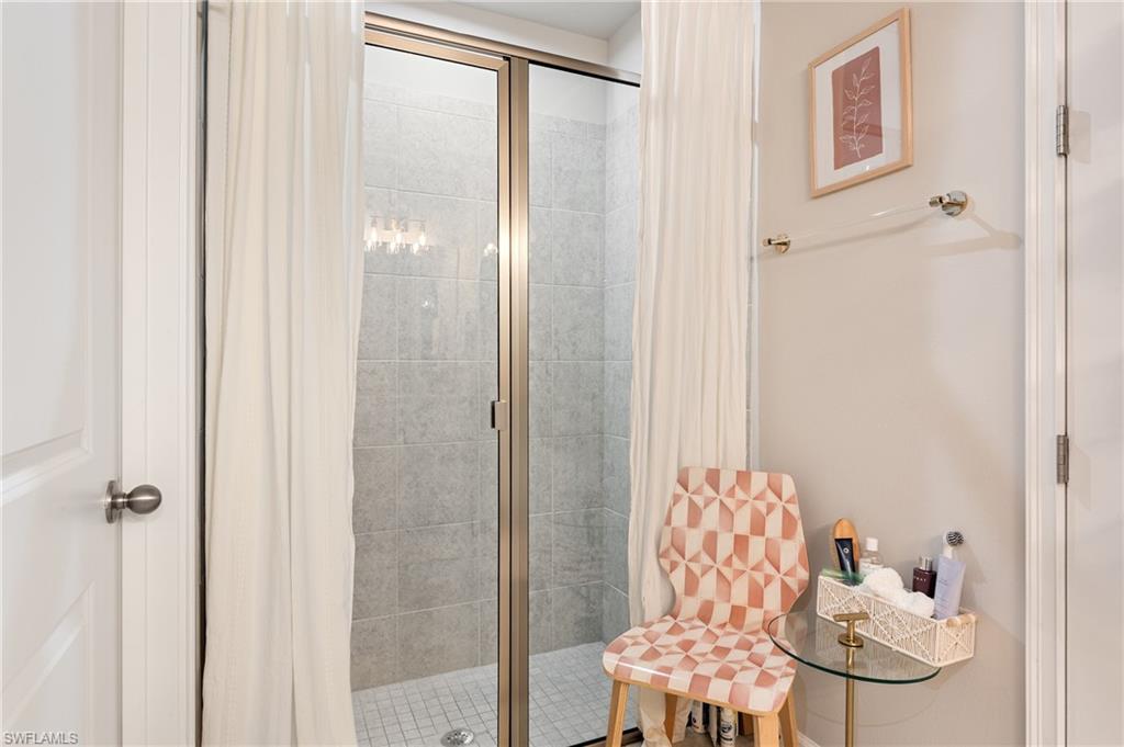 Full bathroom with a shower stall