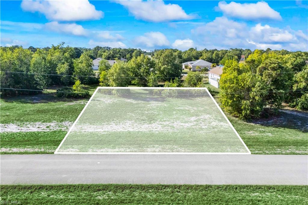 Street view of a peaceful lot in the heart of NW Cape Coral.