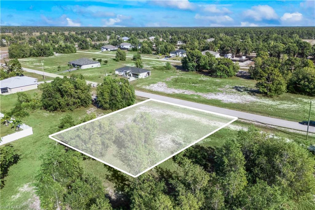 Open space with room for outdoor living, landscaping, or a pool.