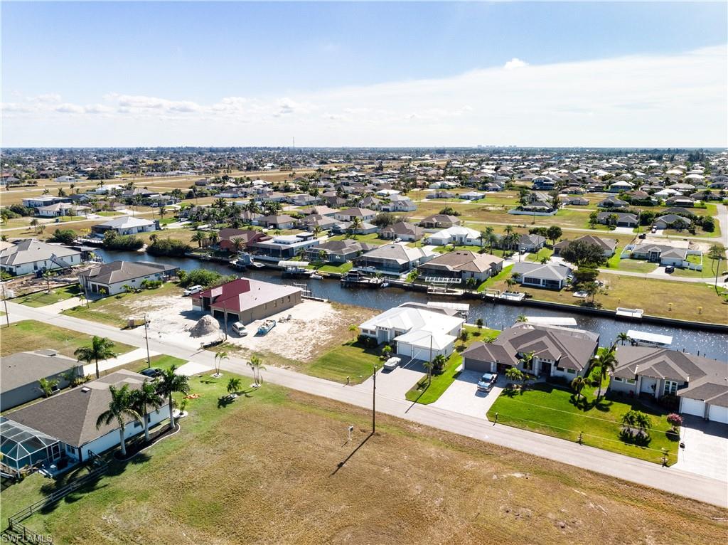 Aerial view of residential area with a nearby body of water