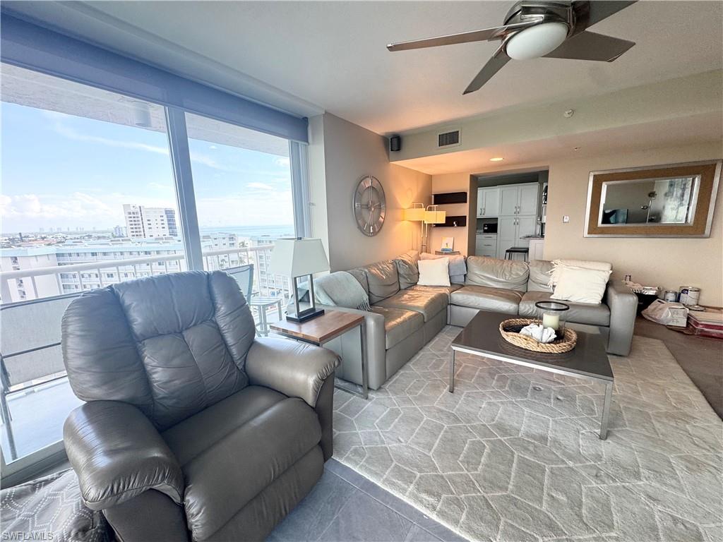 Living area featuring ceiling fan and a view looking south down the beach