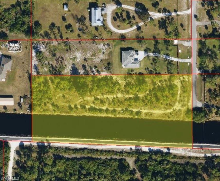 Aerial overview of property's location featuring property boundaries highlighted