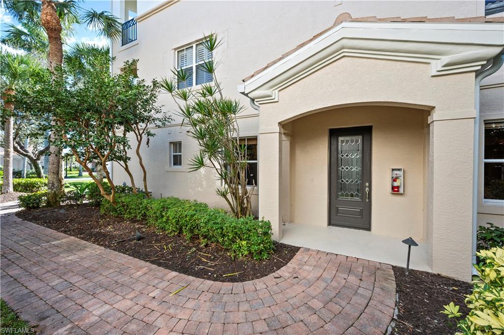 View of exterior entry with stucco siding