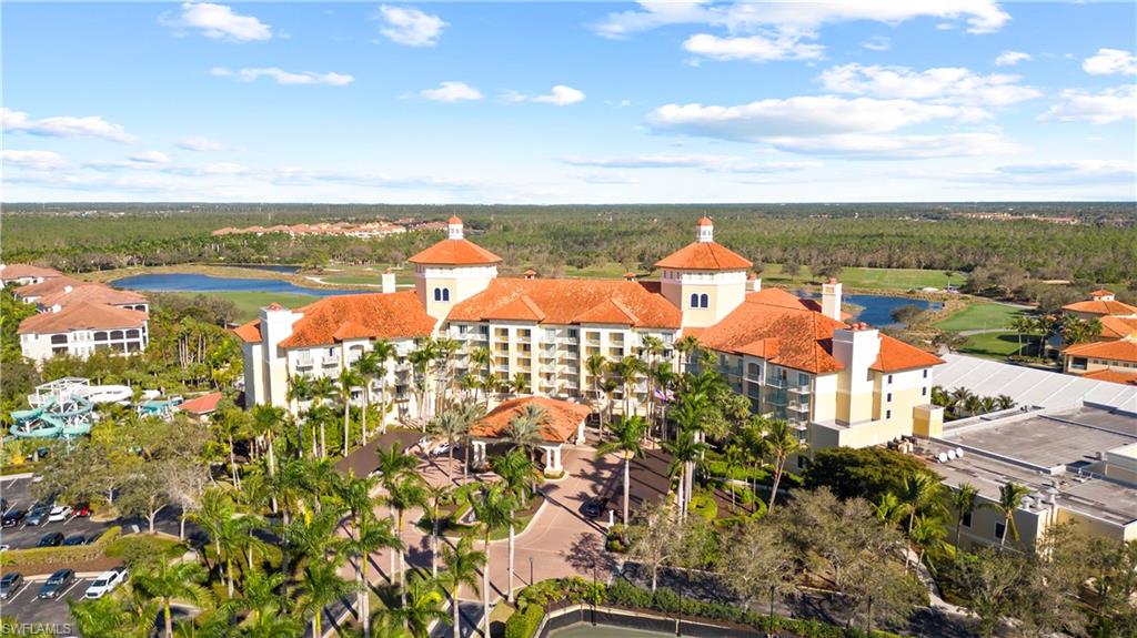 Bird's eye view of a nearby body of water and apartment complex / building