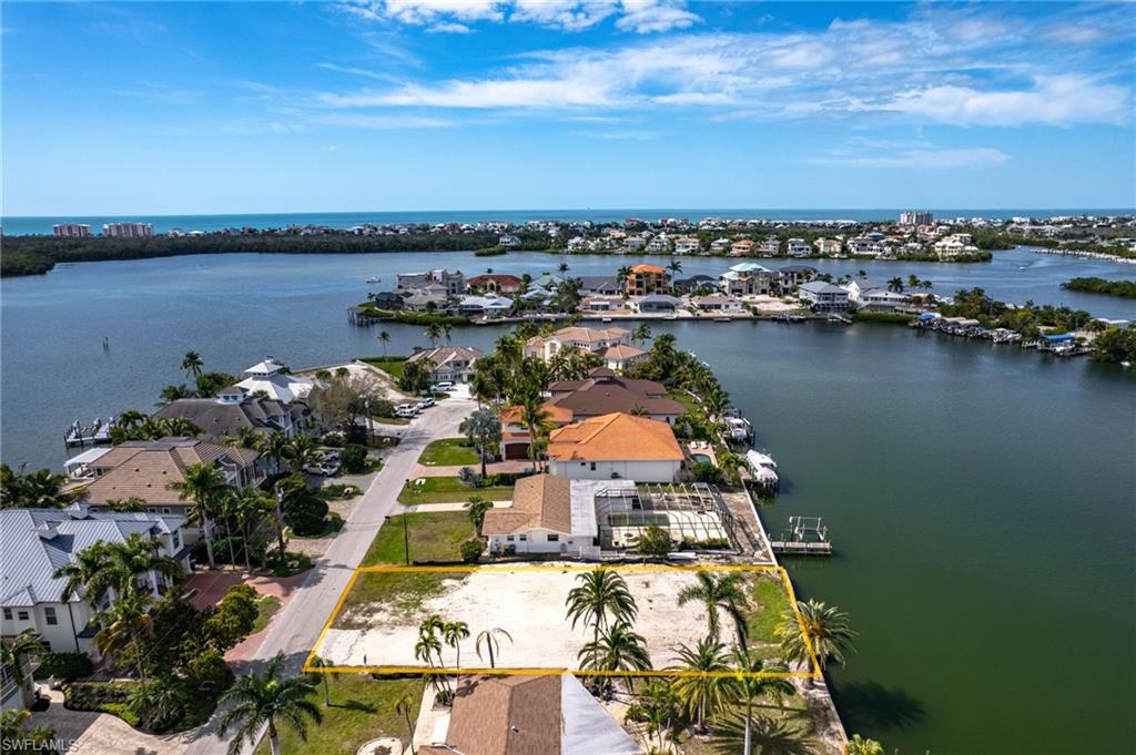 Aerial view of residential area with a nearby body of water