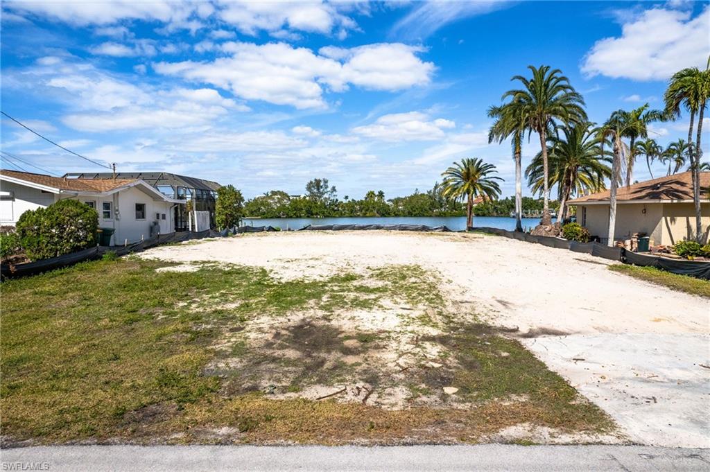 View of yard with a water view