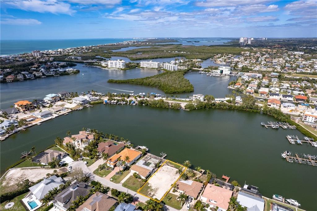View of property location with a nearby body of water and nearby urban area