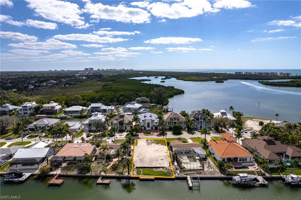 Aerial view of residential area with a nearby body of water