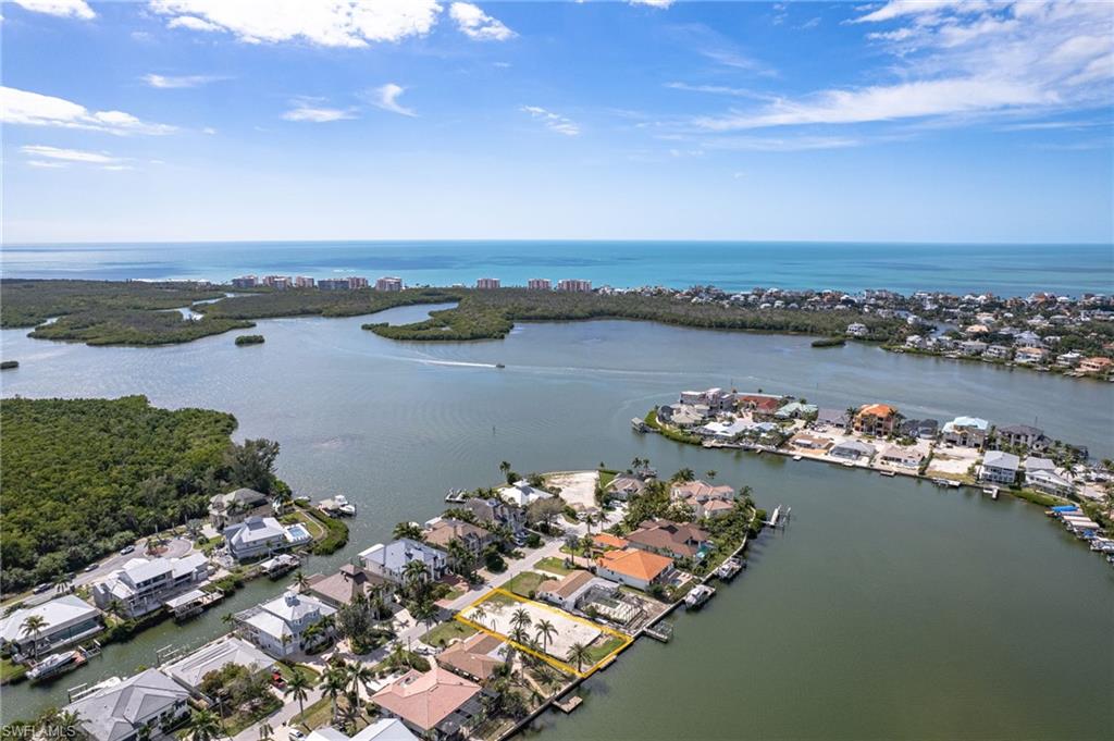 Aerial perspective of suburban area with a large body of water