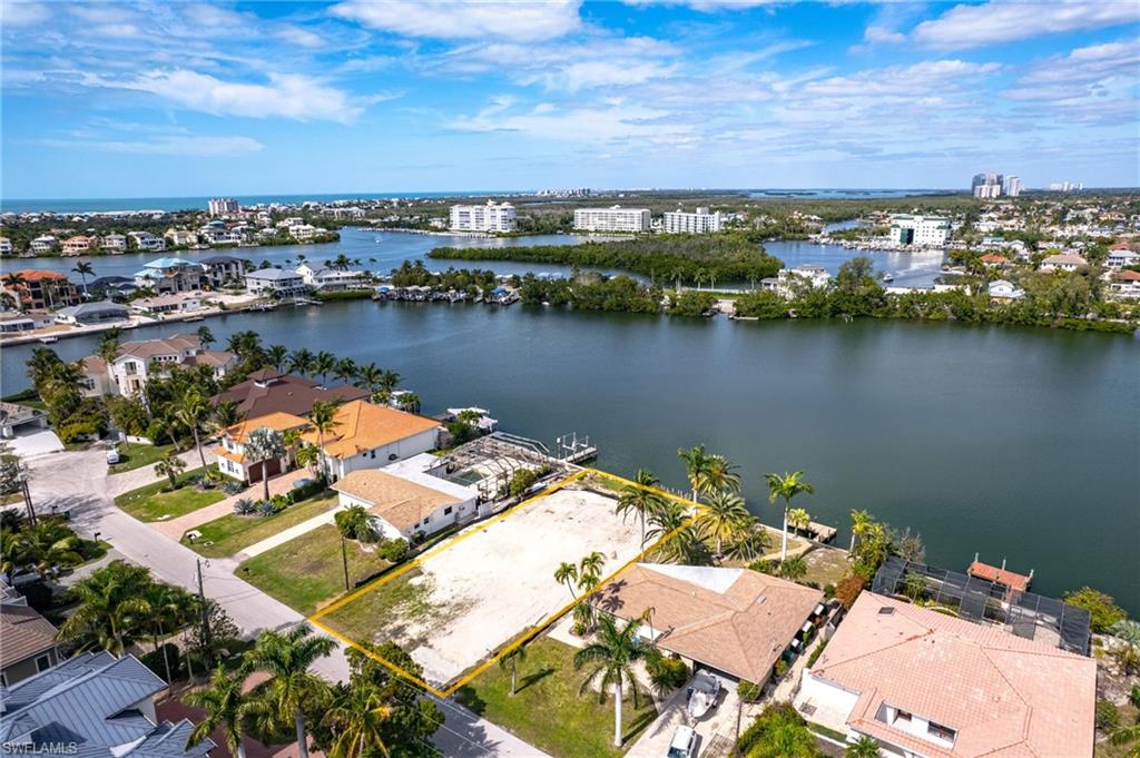 View of urban area featuring a large body of water and nearby suburban area