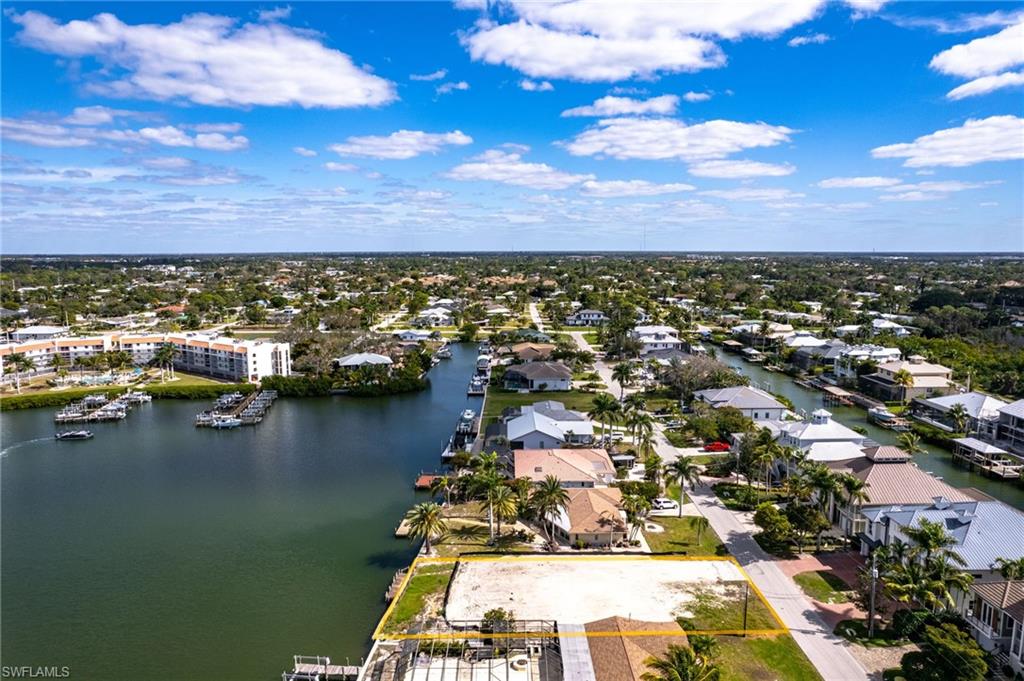 Aerial perspective of suburban area with a large body of water