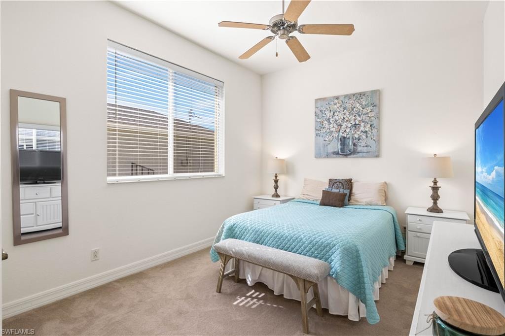 Bedroom featuring carpet and ceiling fan