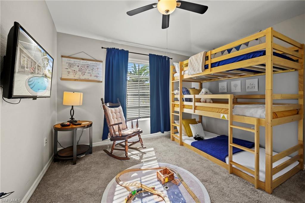 Bedroom with carpet and ceiling fan