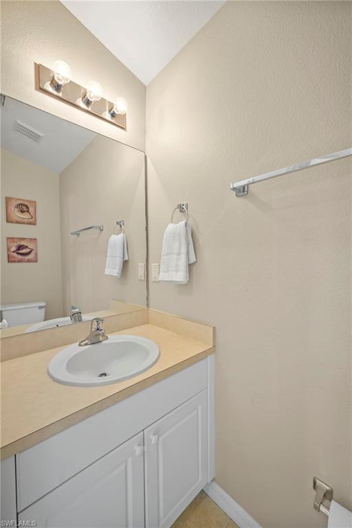 Bathroom with vanity and toilet