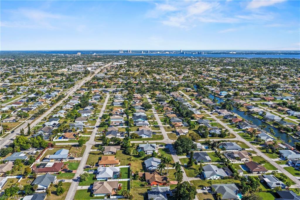 Aerial overview of property's location featuring nearby suburban area
