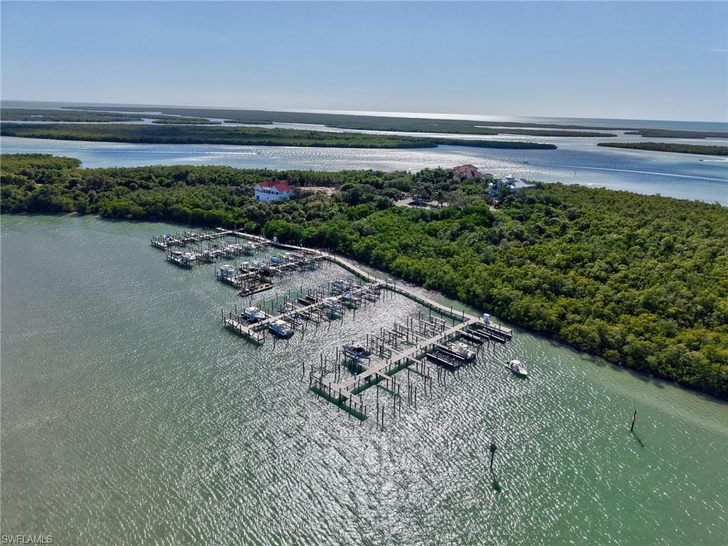 Aerial view of numerous boat docks and a large body of water