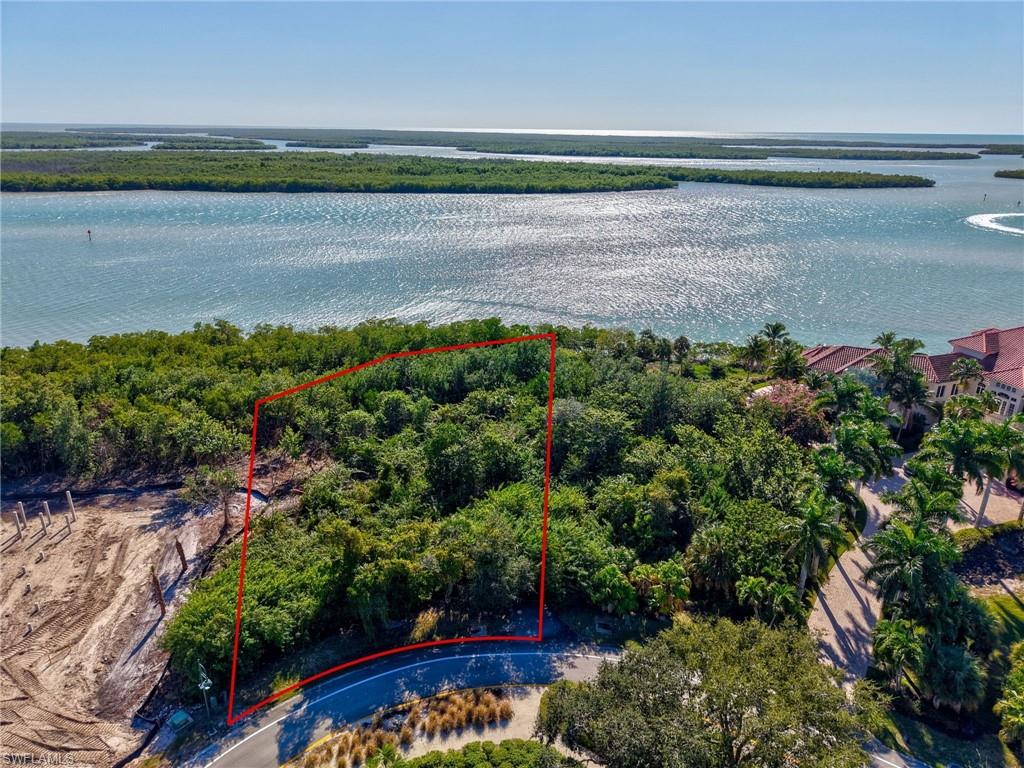 Aerial overview of property's location with property parcel outlined and a large body of water
