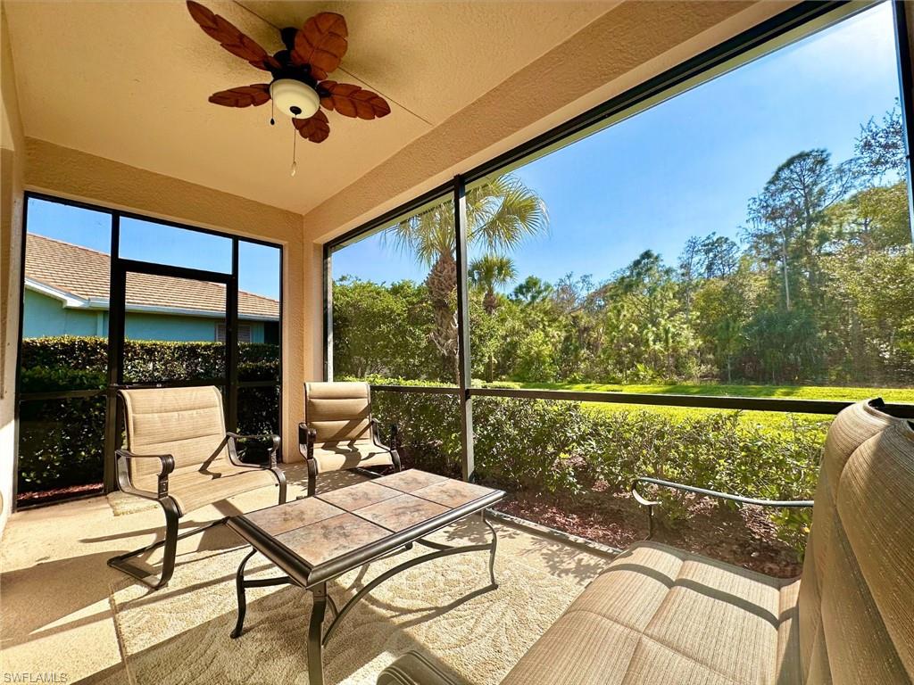 Sunroom / solarium with a ceiling fan