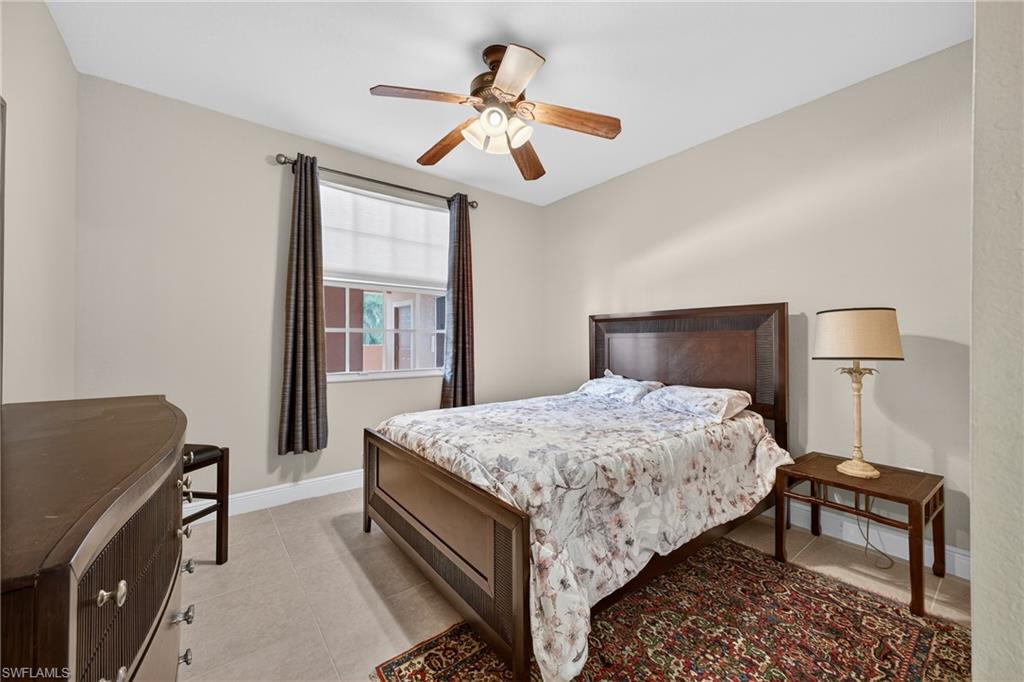 Bedroom featuring a ceiling fan and light tile patterned floors