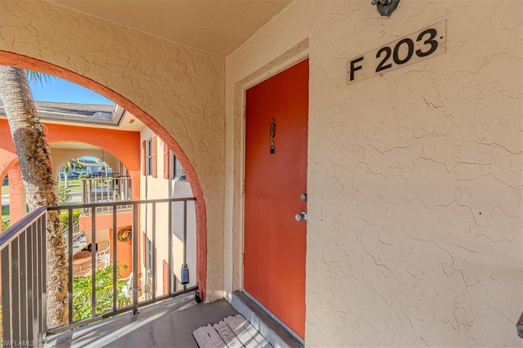 Property entrance featuring stucco siding