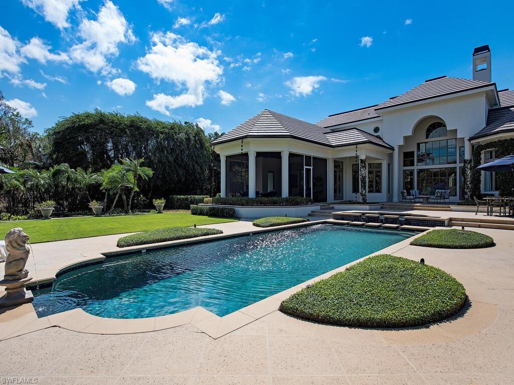 Swimming pool featuring a patio area and a yard