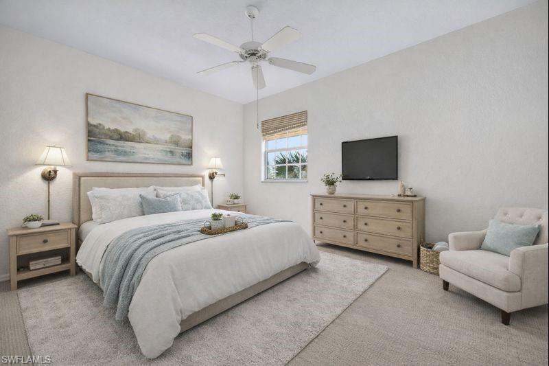 Bedroom with carpet and a ceiling fan