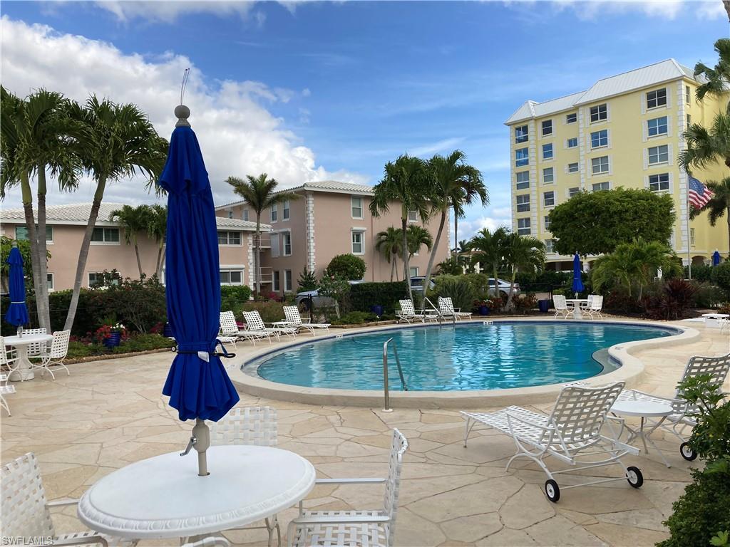 Community pool with a patio