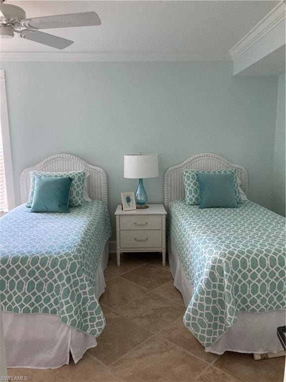 Bedroom featuring crown molding, tile patterned floors, and a ceiling fan