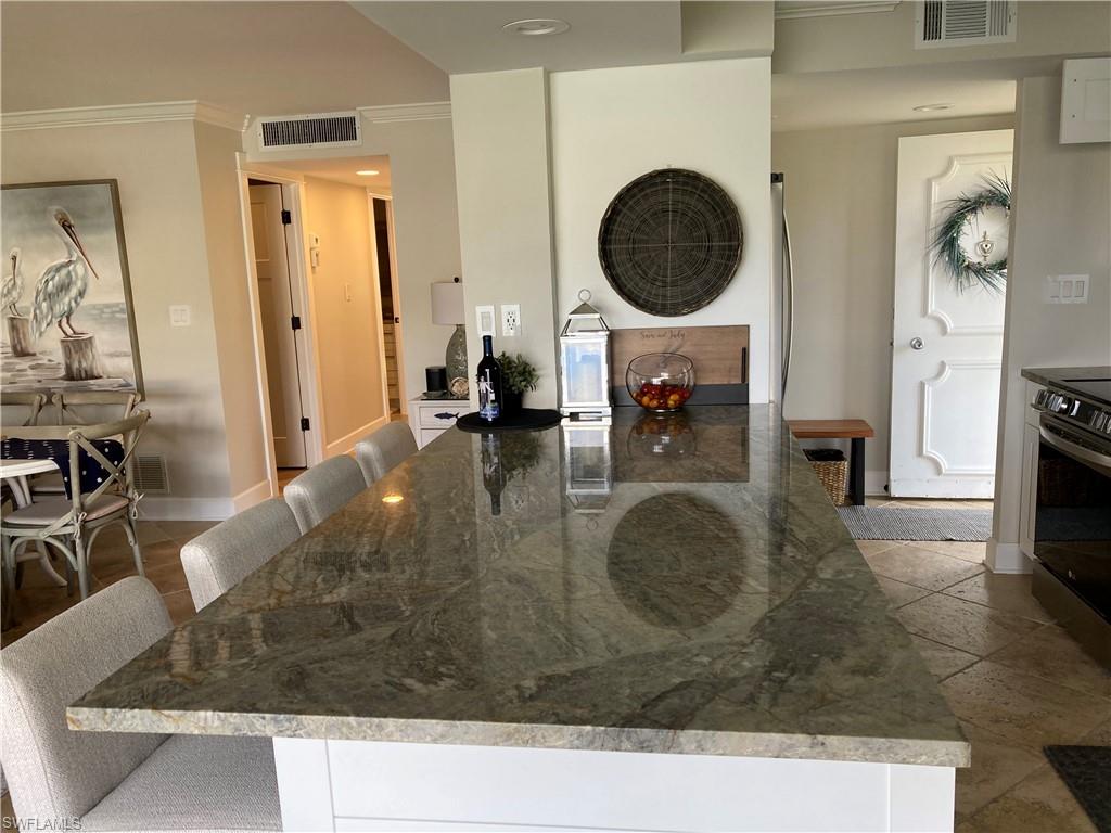 Dining space with crown molding and recessed lighting