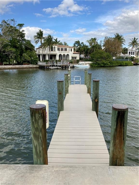 Dock area featuring a water view