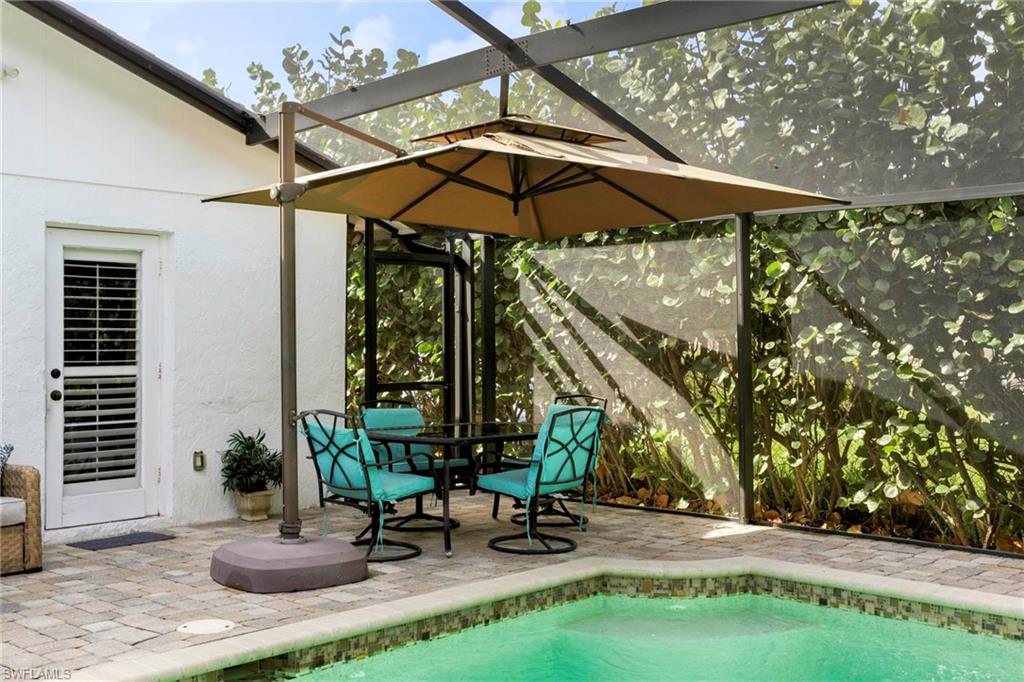 View of swimming pool with a lanai and a patio area