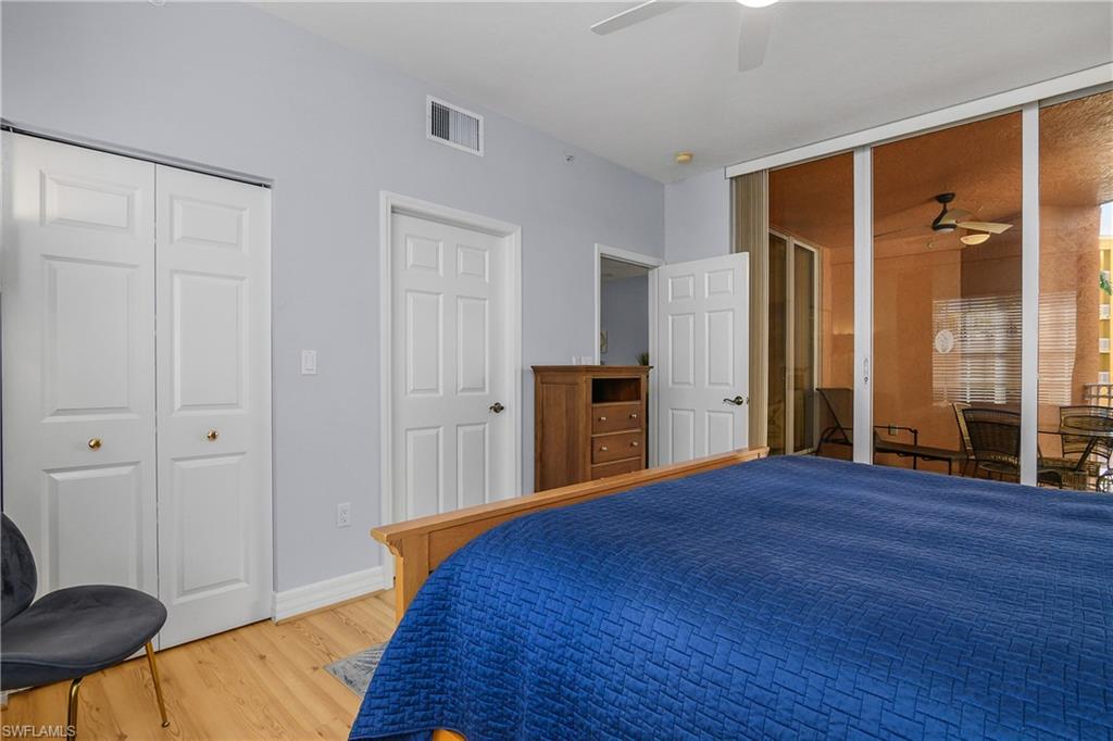 Bedroom featuring light wood-type flooring and a ceiling fan