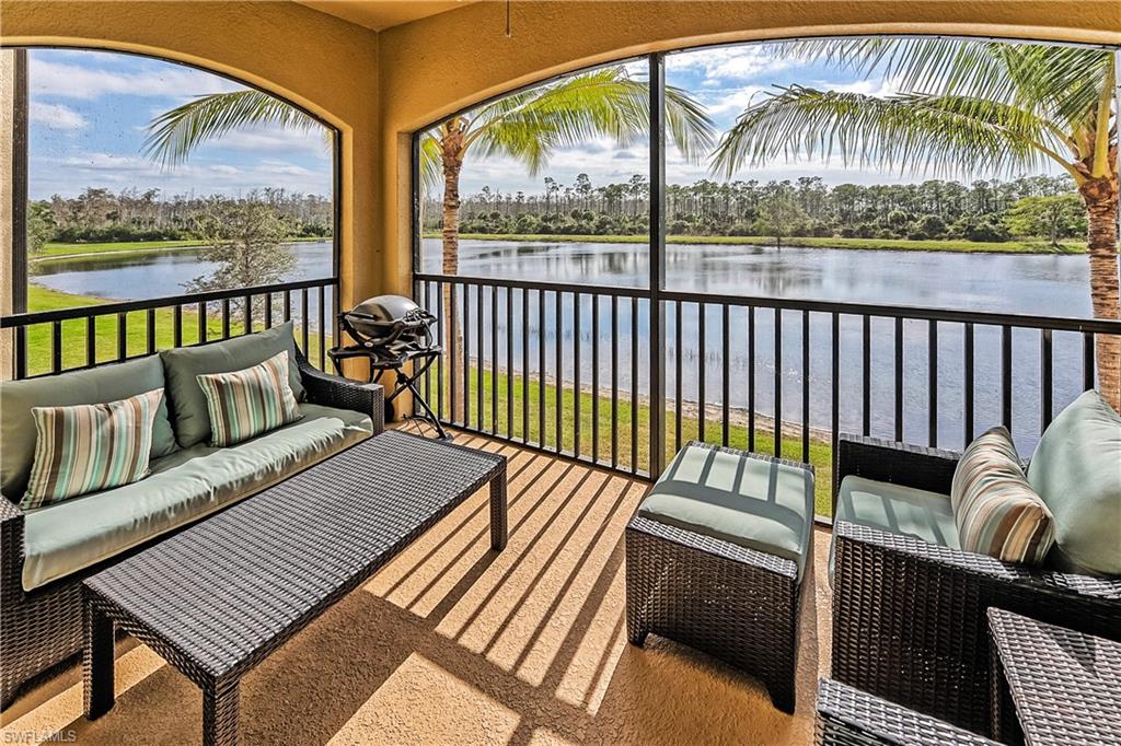 Sunroom / solarium with a water view