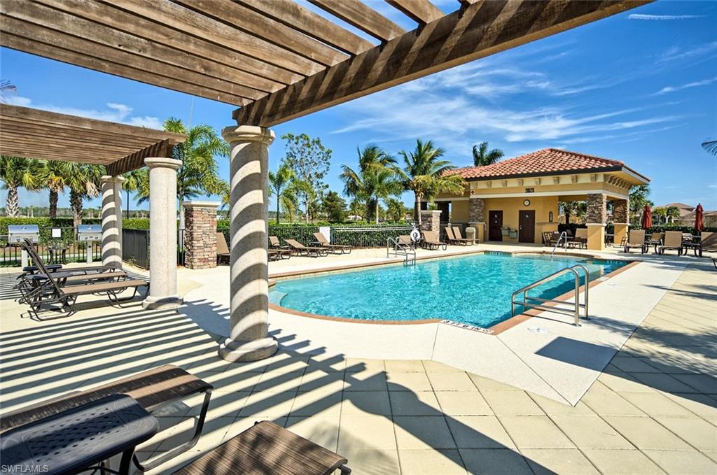 Community pool featuring a patio and a pergola