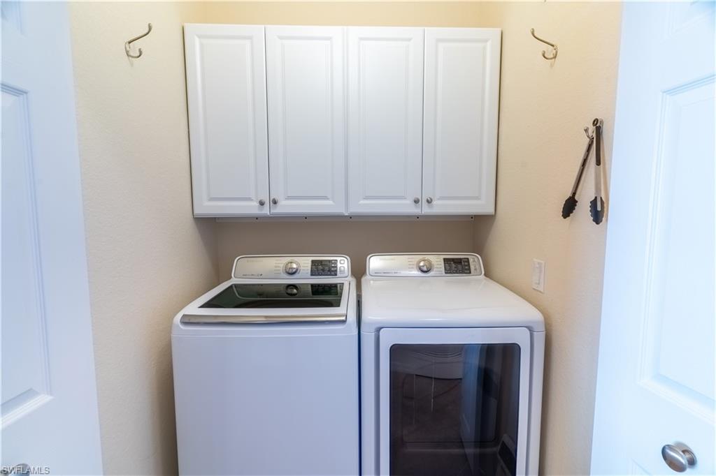Laundry area with cabinet space and washer and dryer
