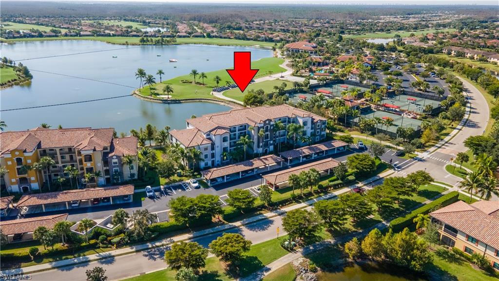 Bird's eye view of a nearby body of water and apartment complex / building