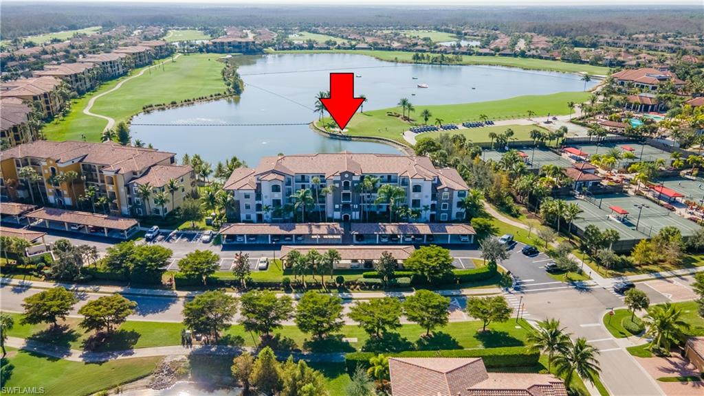 Drone / aerial view of a large body of water and a golf course