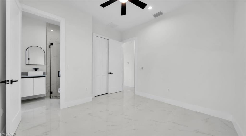 Unfurnished bedroom with light marble finish floors, recessed lighting, and ceiling fan