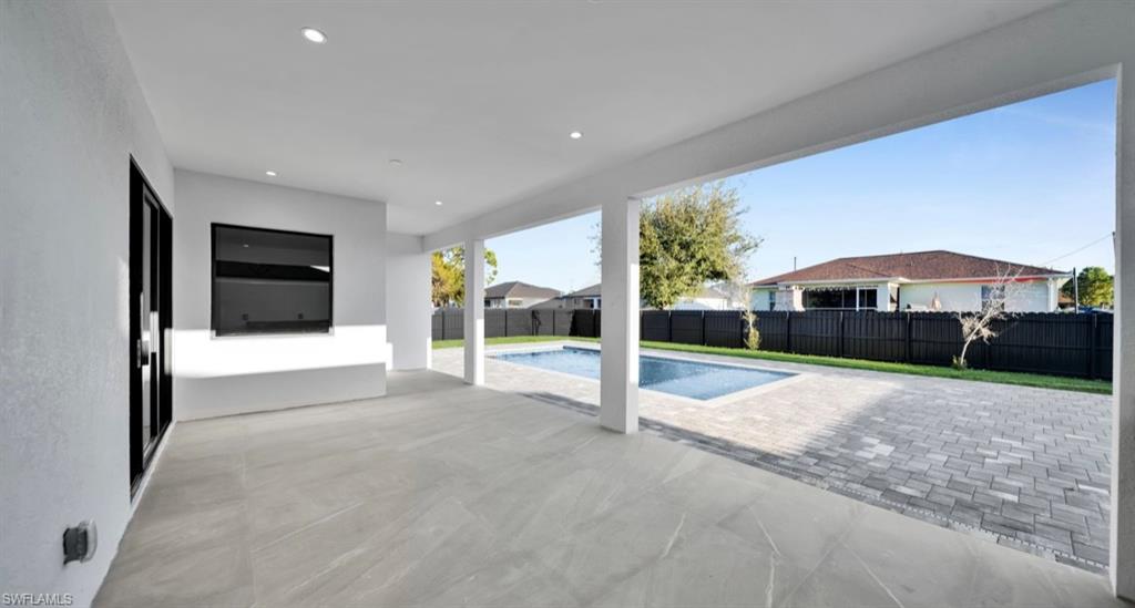 View of pool featuring a patio area and a fenced backyard