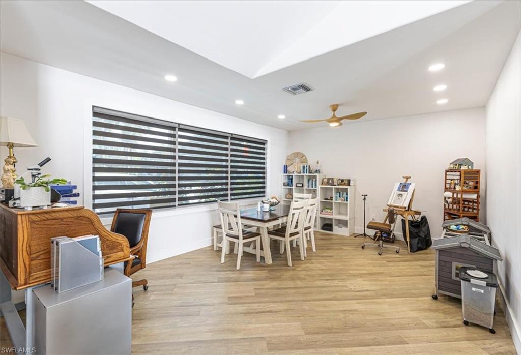 Dining area featuring recessed lighting, light wood-style flooring, and a ceiling fan