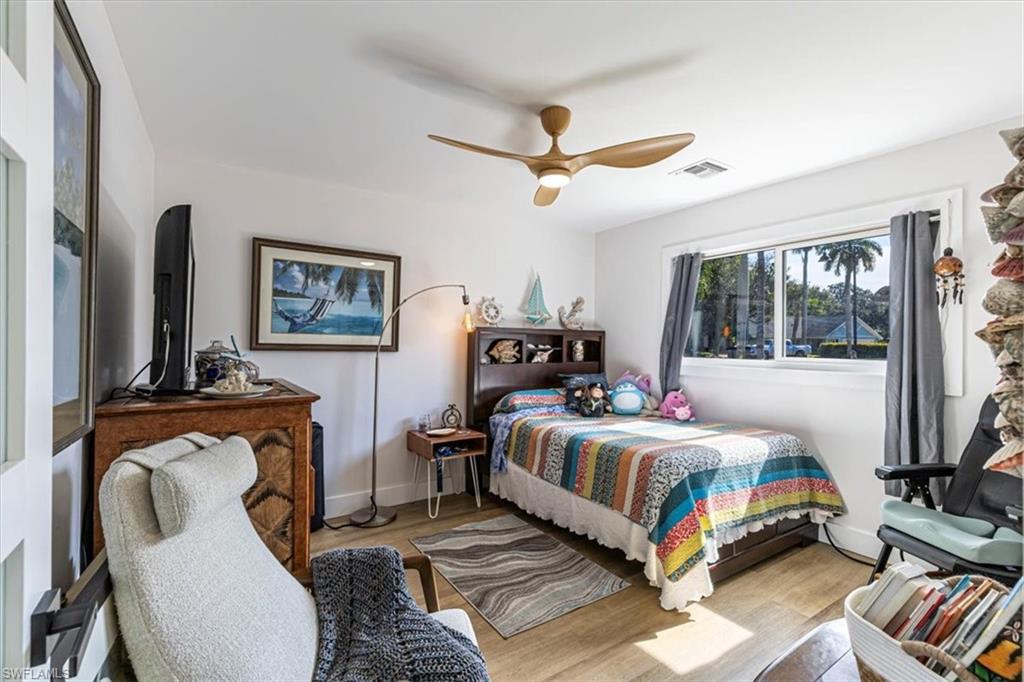 Bedroom featuring wood finished floors and a ceiling fan