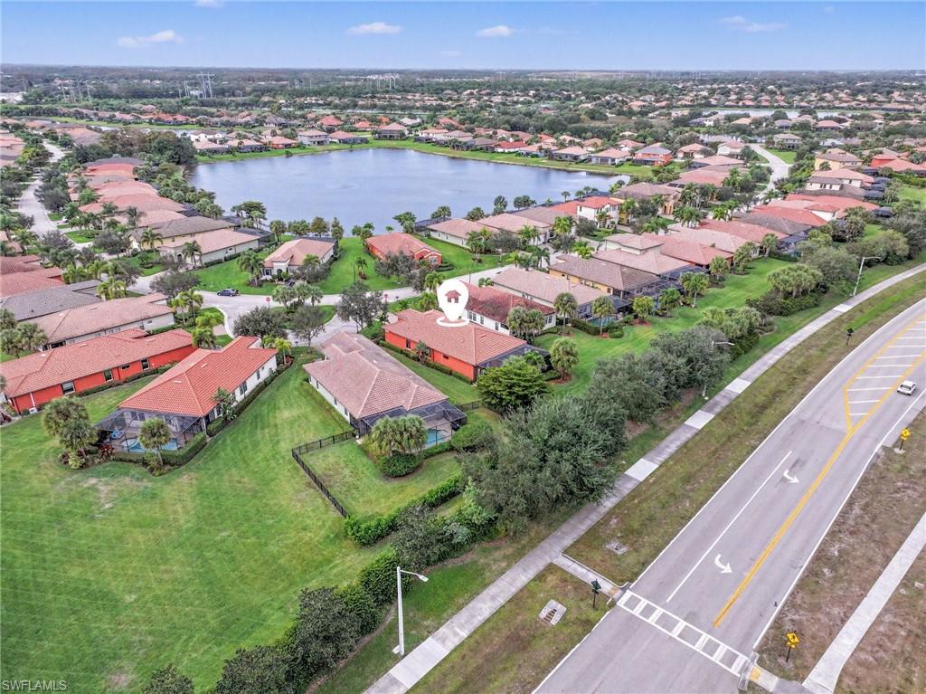Aerial view of property's location with nearby suburban area