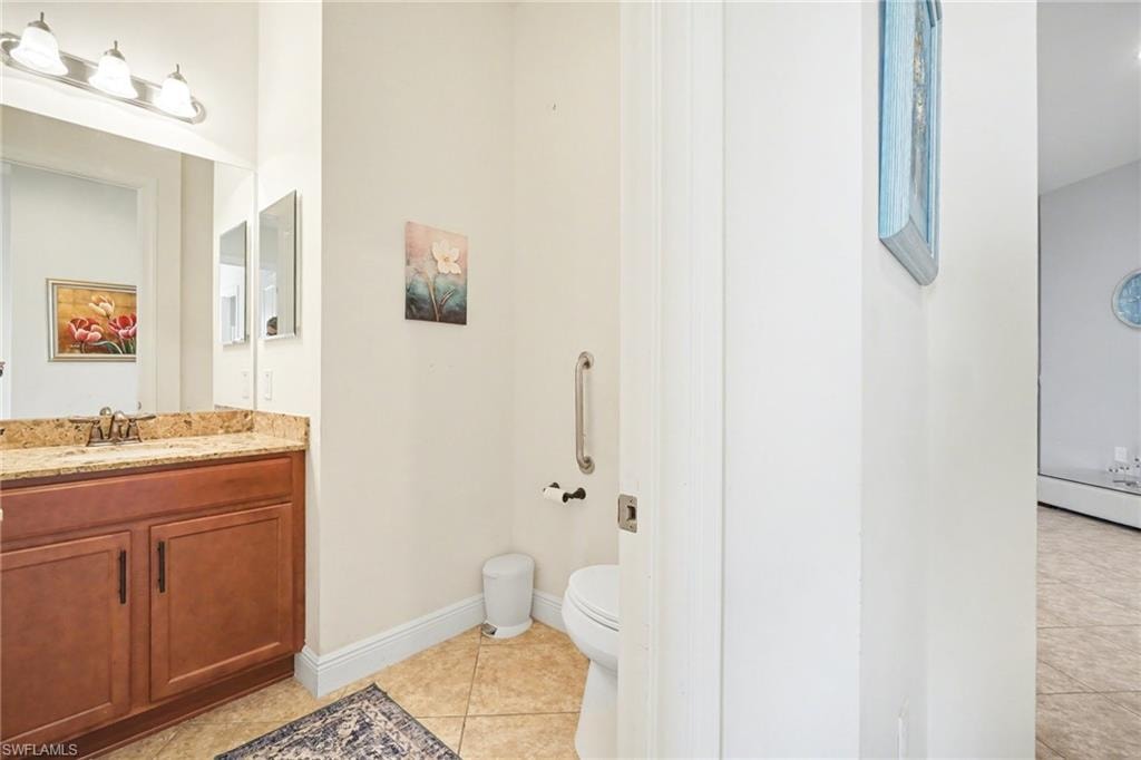 Bathroom with vanity and light tile patterned floors