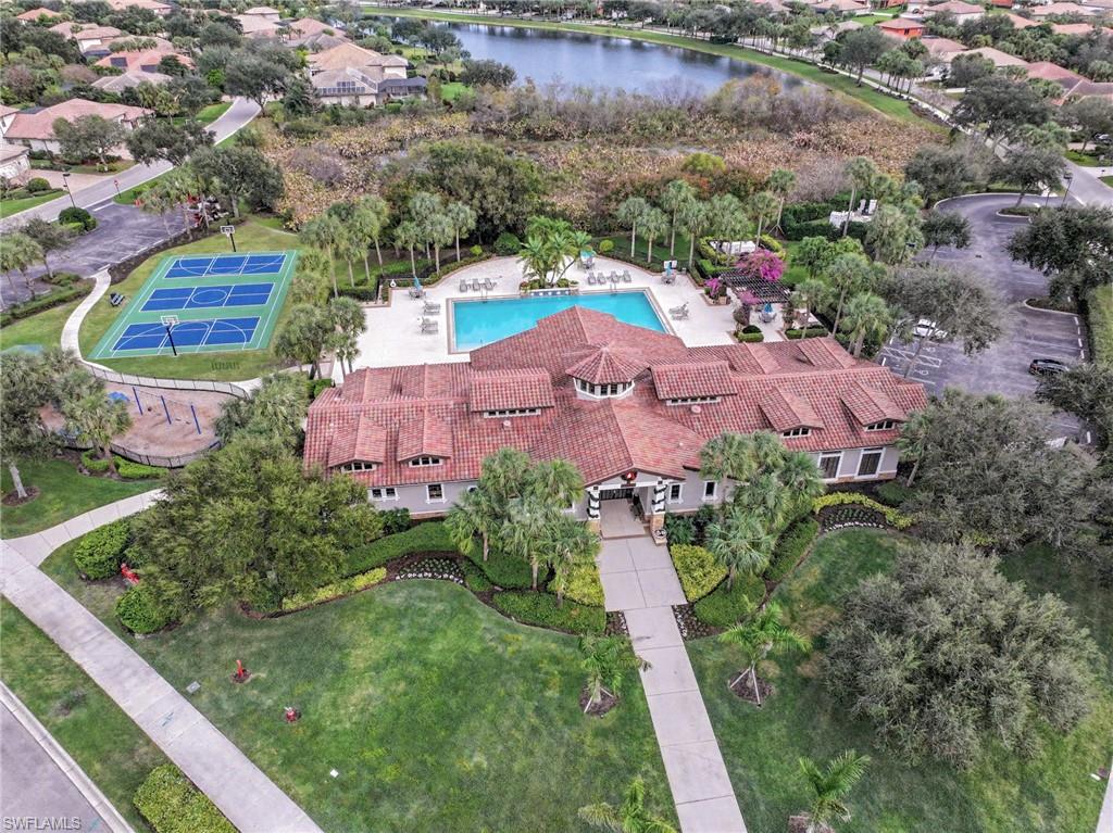 Aerial view of a pool and a nearby body of water