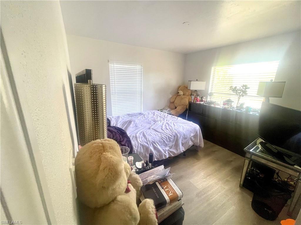 Bedroom with wood finished floors