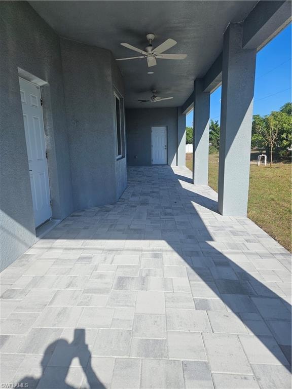 View of patio with ceiling fan