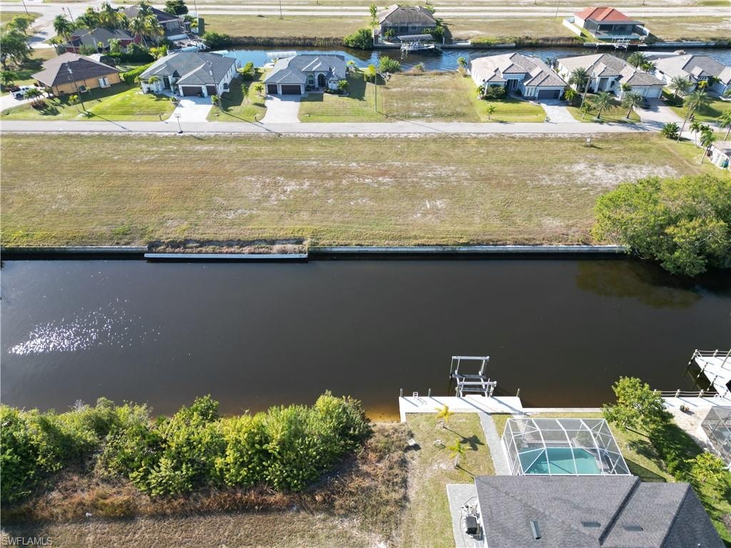 Aerial perspective of suburban area with a nearby body of water